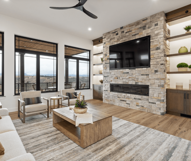 Upstairs living room with open windows and fireplace at Cloud Peak