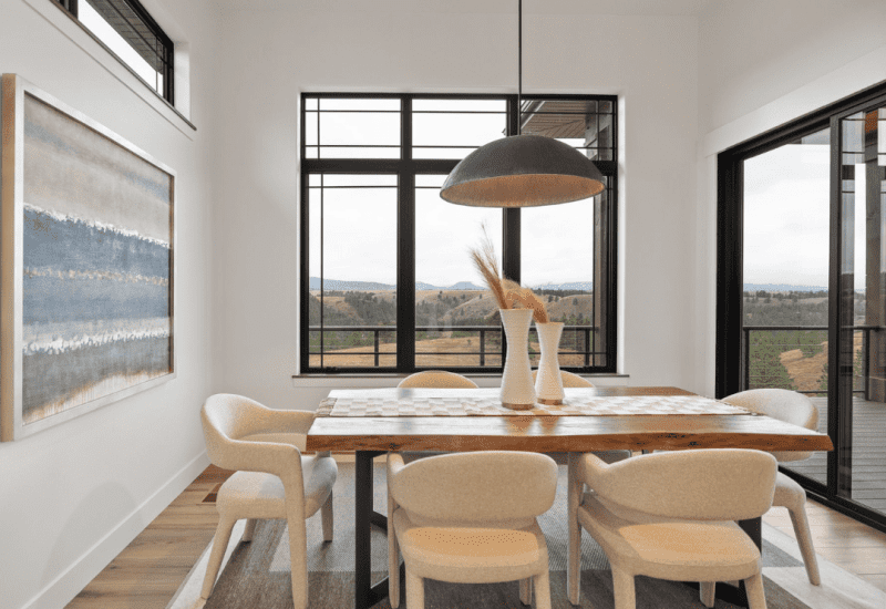 Dining table at Cloud Peak with large windows overlooking the Black Hills