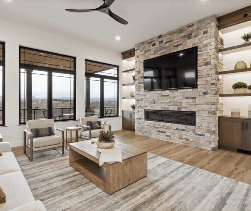 Upstairs living room with open windows and fireplace at Cloud Peak