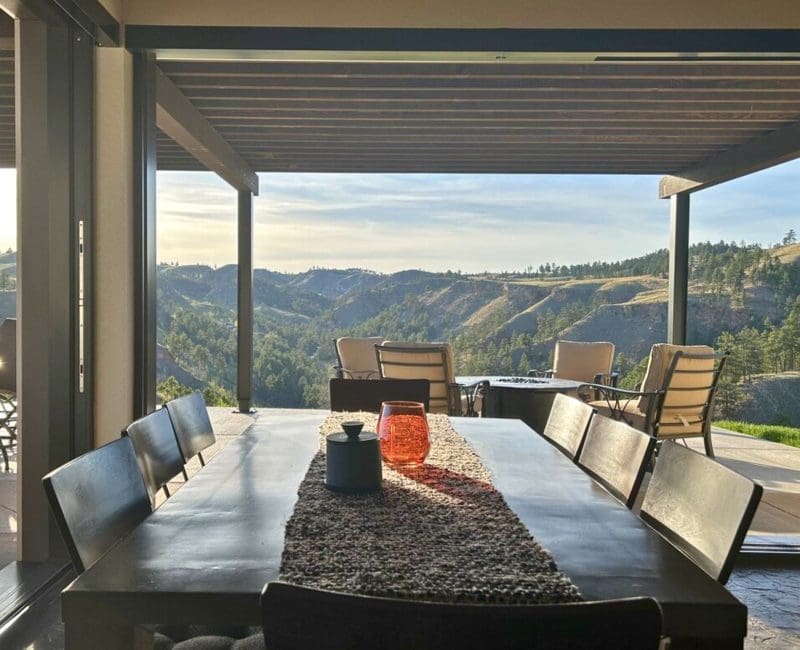 Open patio of a luxury custom home overlooking the Black Hills